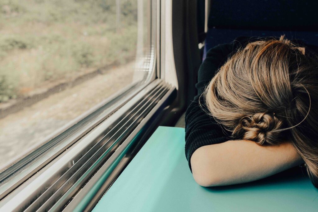 A girl leaning her head on the table