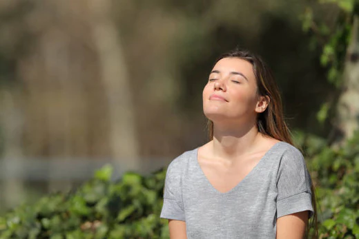 A girl taking a deep breath