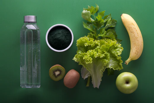 Water beside some fruits and vegetables